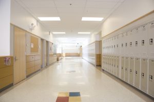 High school hallway with lockers and LED lighting
