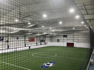 A view of Soccer City's soccer field through a net